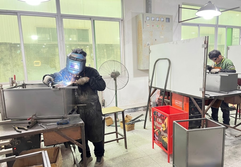BEVIS fabricators welding a custom metal display prototype